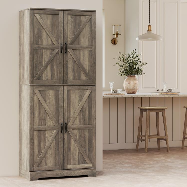 Gray wash farmhouse pantry cabinet with four barn doors and black handles