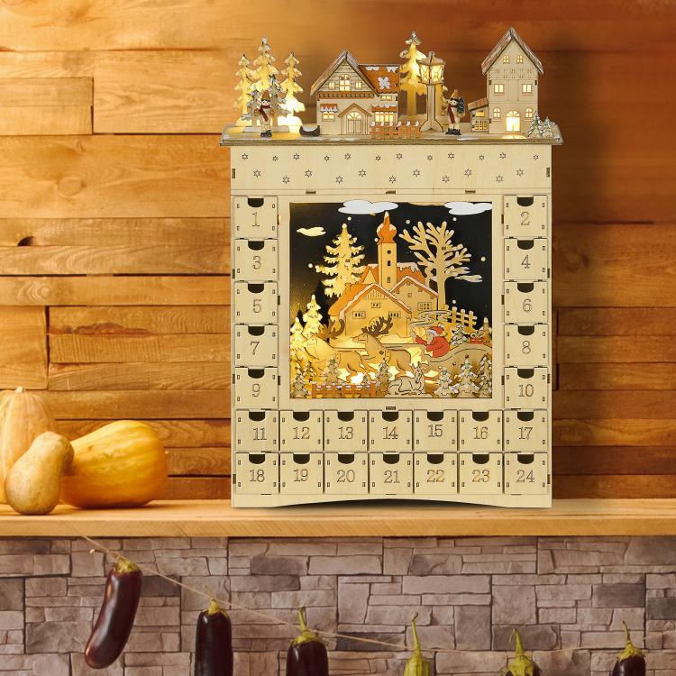 Wooden advent calendar with illuminated winter landscape window and 24 numbered drawers