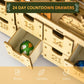 Wooden advent calendar drawer with a numbered slot holding a small Christmas globe