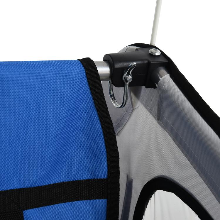 Close-up of blue seat edge and hitch attachment on a child bike trailer