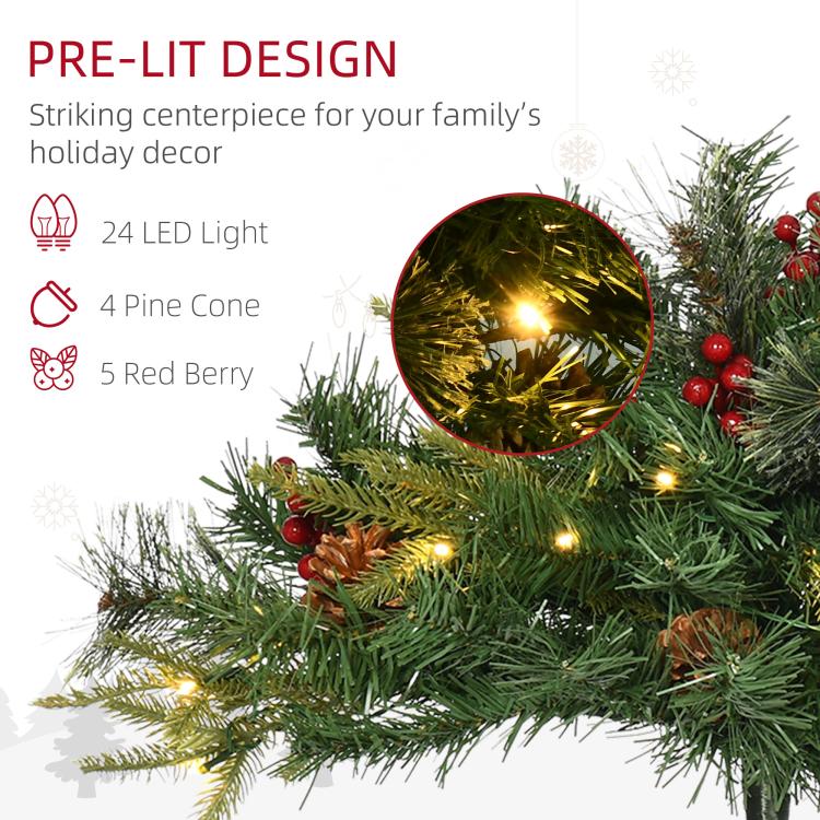 Pre-lit artificial Christmas tree branch with warm white lights, red berries, and pine cone