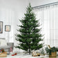Green artificial Christmas tree with dense branches and metal tripod base