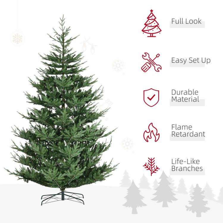 Green artificial Christmas tree with metal tripod base and life-like pine branches