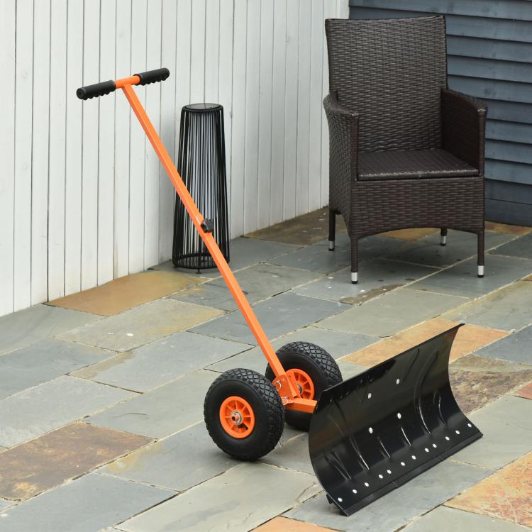 Orange rolling snow shovel with wide black blade on wheels