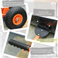 Orange rolling snow shovel with textured black wheels and cushioned grip handle