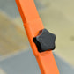 Orange handle close-up with black cushioned grip