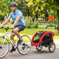 Red dog bicycle trailer with front mesh door window and suspension wheels