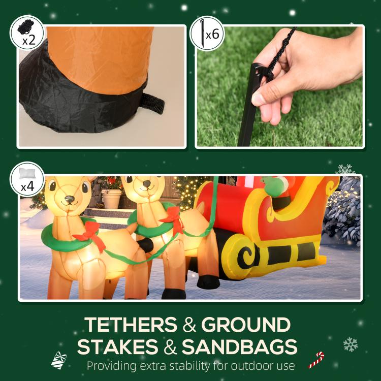 Inflatable yard decoration with tethers, ground stakes, and sandbags for outdoor use