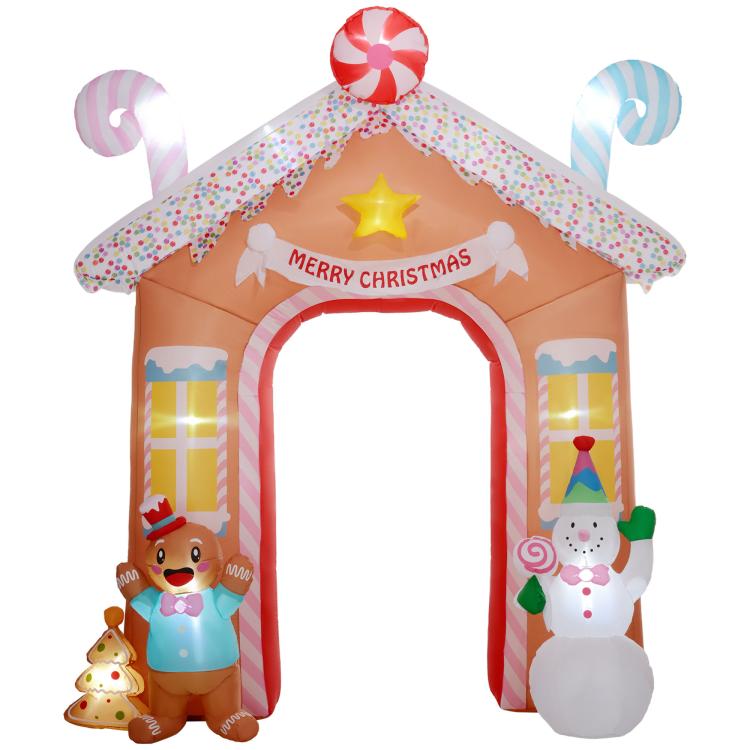 Inflatable candy house archway with “MERRY CHRISTMAS” banner and striped roof