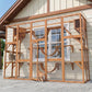 Outdoor wooden cat playhouse enclosure with mesh walls, ladders, and curved bridge tunnels