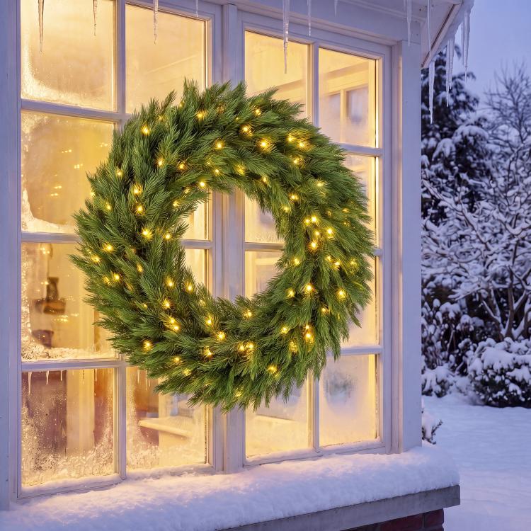 Green pre-lit outdoor Christmas wreath with warm LED lights, circular evergreen garland