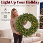 Green pre-lit artificial Christmas wreath with warm LED lights, circular evergreen ring