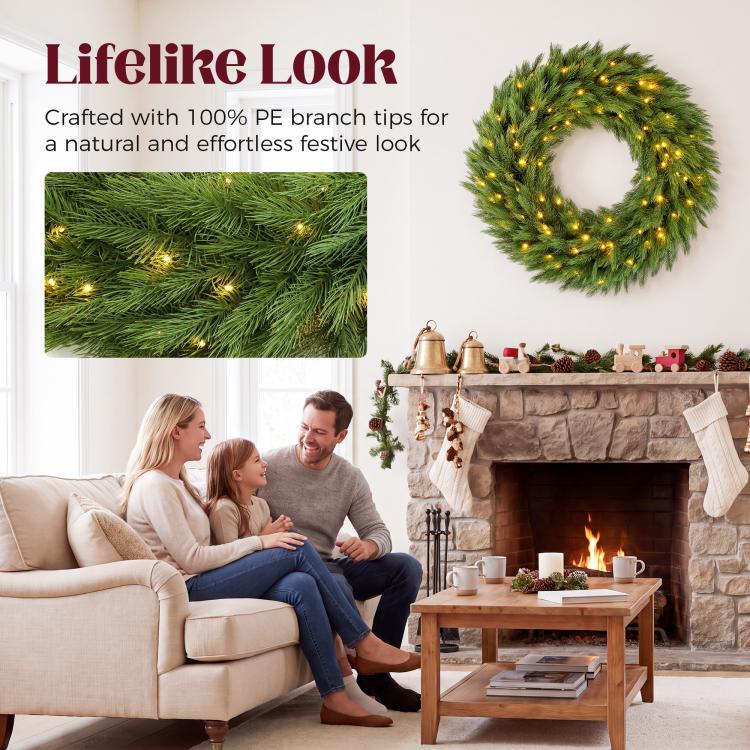 Green pre-lit artificial wreath with warm LED lights, compact circular evergreen form