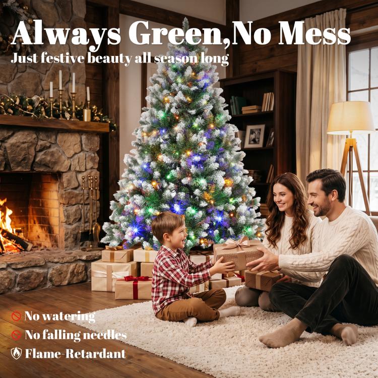 Frosted artificial Christmas tree with multicolor LED lights next to fireplace