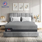 Grey queen memory foam mattress on bed frame with two pillows