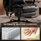 Black cushioned footrest and seat base detail on a heated massage office chair