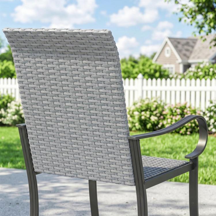Gray woven wicker outdoor dining chair with dark armrests and steel frame