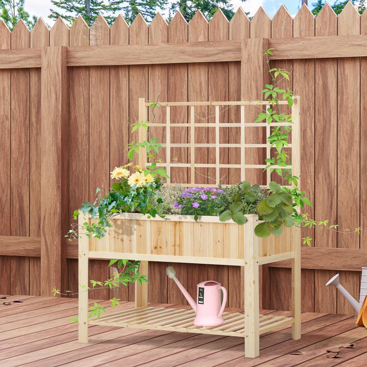 Wooden raised garden bed with trellis, flower boxes, and watering can on patio