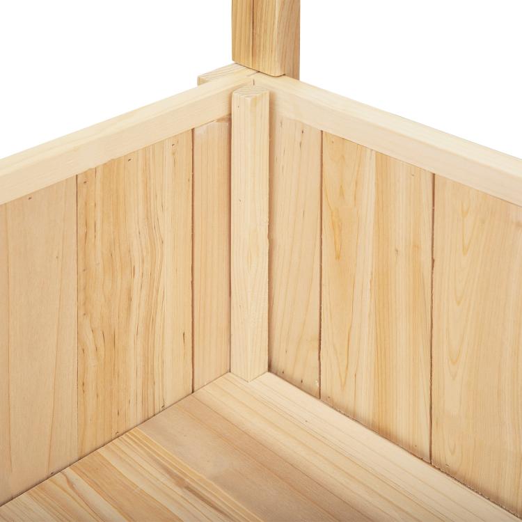 Wooden raised garden bed interior corner with slatted bottom