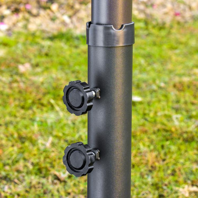 Patio umbrella crank handle hardware on dark pole