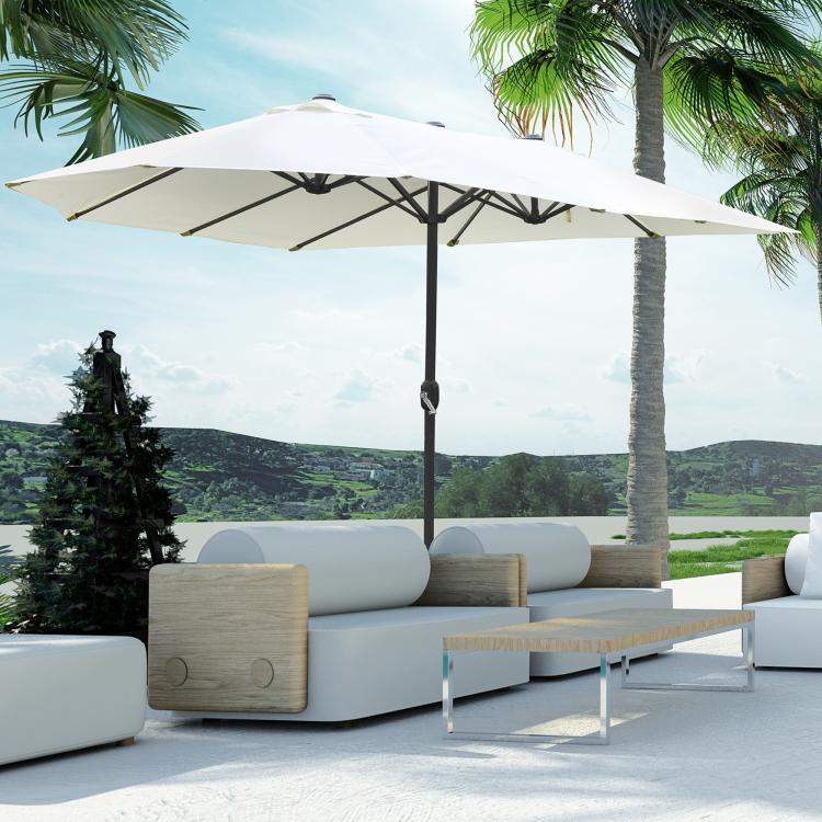 Beige patio umbrella open over patio seating, central dark pole with weighted base