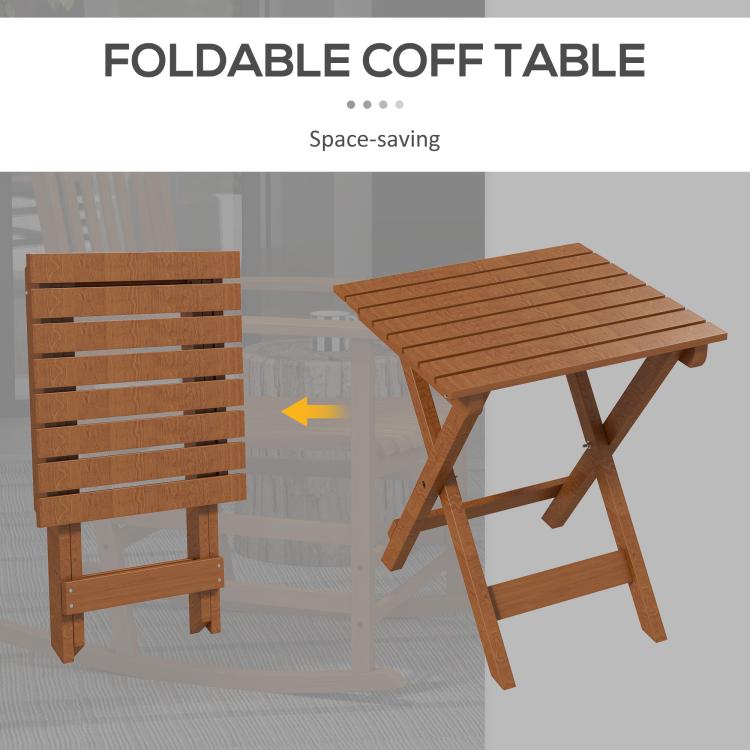 Foldable brown side table with slatted top and folding frame beside rocking chairs
