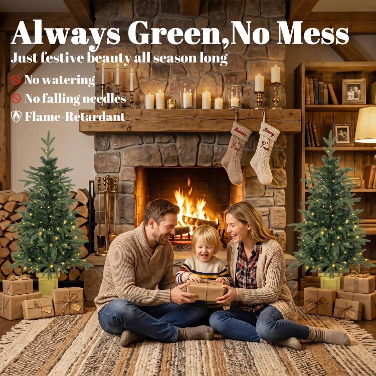 Family scene with two prelit Christmas trees featuring glowing lights on golden stands.