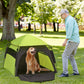 Green and black dog tent with front mesh door, dog inside, ready for outdoor use