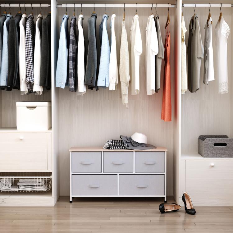 Light gray fabric storage dresser unit with 5 drawers and wood top, white frame.