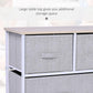 Wood tabletop of light gray 5-drawer fabric storage dresser above drawers, white frame.