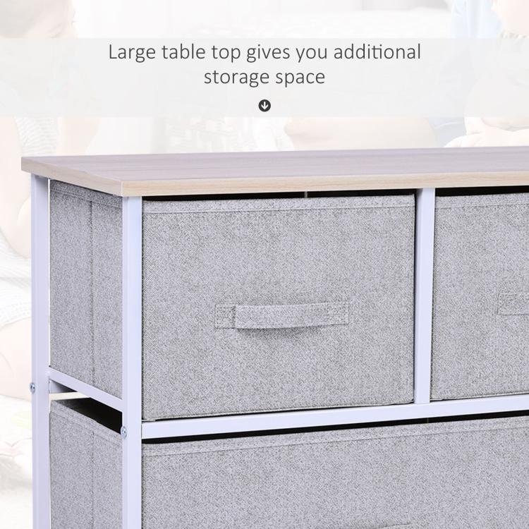 Wood tabletop of light gray 5-drawer fabric storage dresser above drawers, white frame.