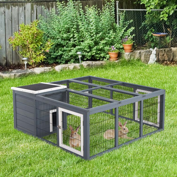Gray rabbit hutch with mesh sides, double doors, and wire-top roof on lawn