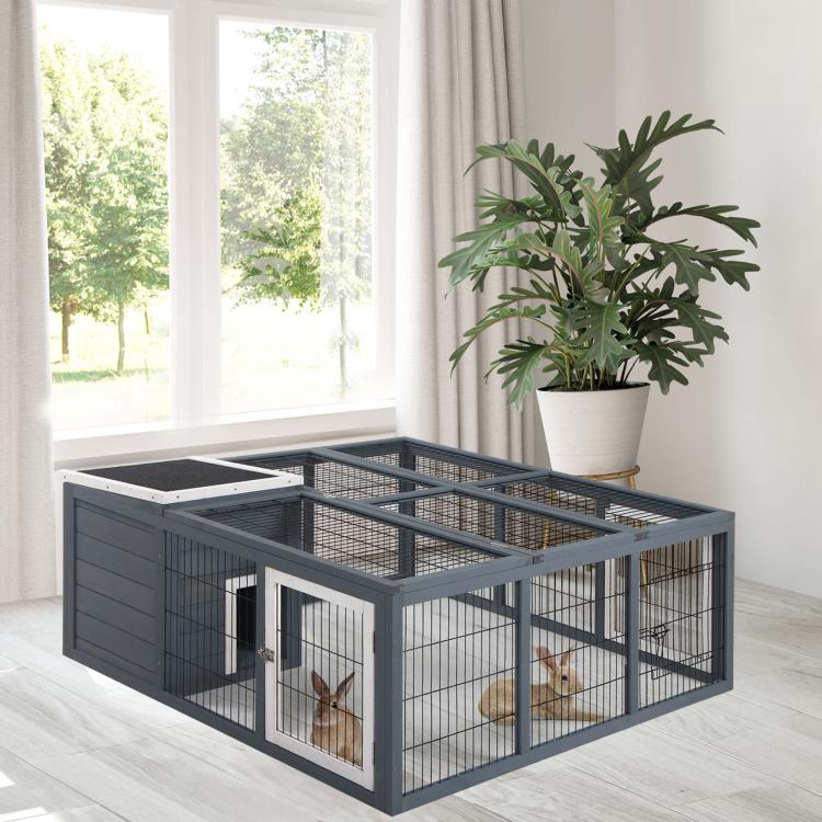 Gray wire rabbit hutch with double front doors and mesh roof indoors