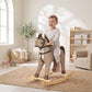 Rocking horse ride-on toy in dark brown fabric with black harness and wooden base