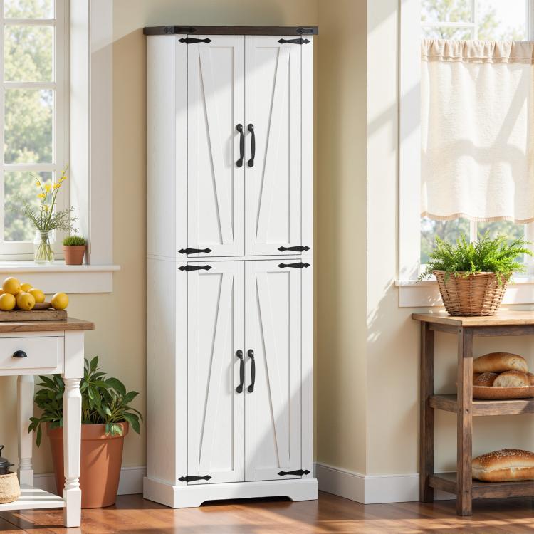 White tall pantry cabinet with barn doors and black hardware in a room setting