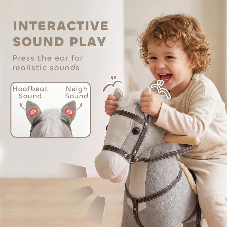 Gray plush rocking horse ride-on toy with bridle and reins, toddler holding handles