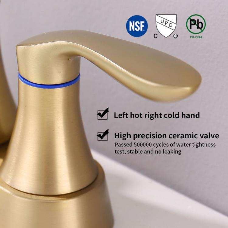 Brushed gold bathroom faucet with single spout and two handles, close-up view