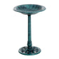 Teal-green outdoor bird bath with round bowl and ornate pedestal base