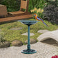 Outdoor bird bath pedestal with teal bowl and colorful bird near the rim