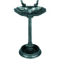 Verdigris bird bath pedestal with two small bird figurines above a scalloped basin