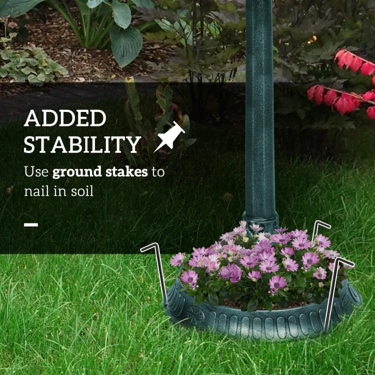 Verdigris bird bath with stability stakes, set on flowered lawn garden