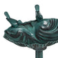 Close-up of verdigris bird bath basin with two bird figurines and shell details