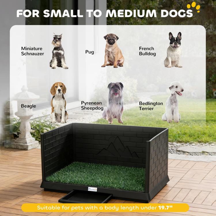 Artificial grass indoor potty tray with high walls and drain tray, shown with dog yard backdrop