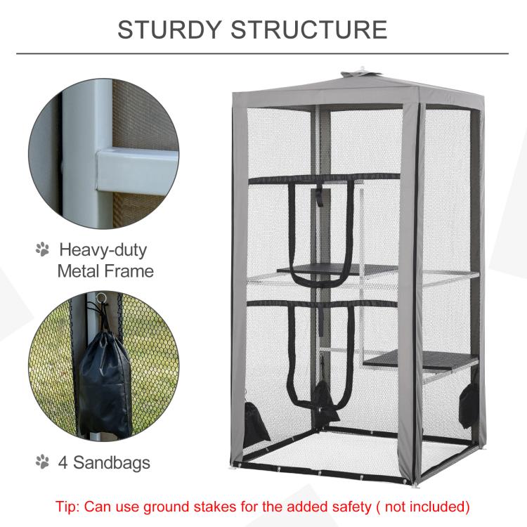 Gray metal frame cat playpen with mesh walls and sandbag anchors