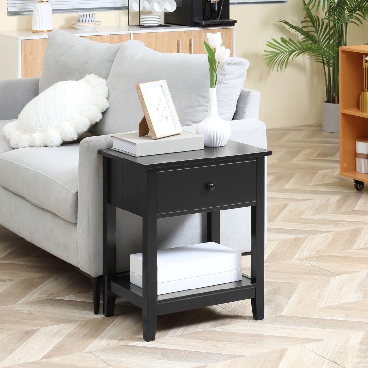 Black end table with drawer and open bottom shelf, squared top and dark frame.