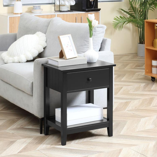 Black end table with drawer and open bottom shelf, squared top and dark frame.