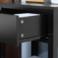 Black drawer interior and hardware close-up on two-tier side table.