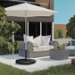 Black umbrella cross base stand holding an outdoor cantilever umbrella