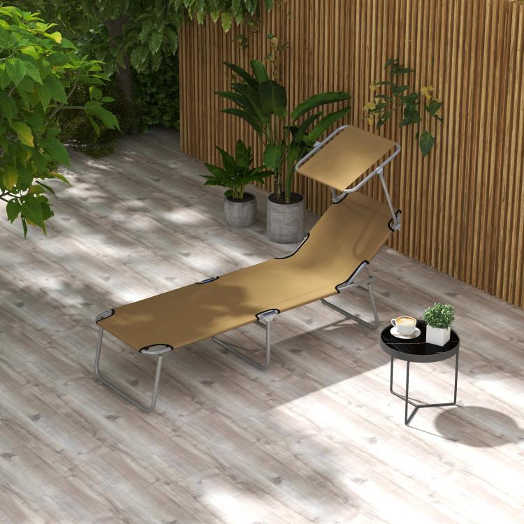 Tan outdoor chaise lounge chair with sun shade canopy and folding metal frame