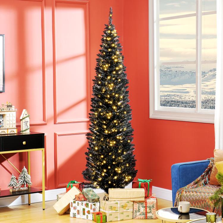 Pre-lit slim pencil Christmas tree with warm white LED lights standing indoors